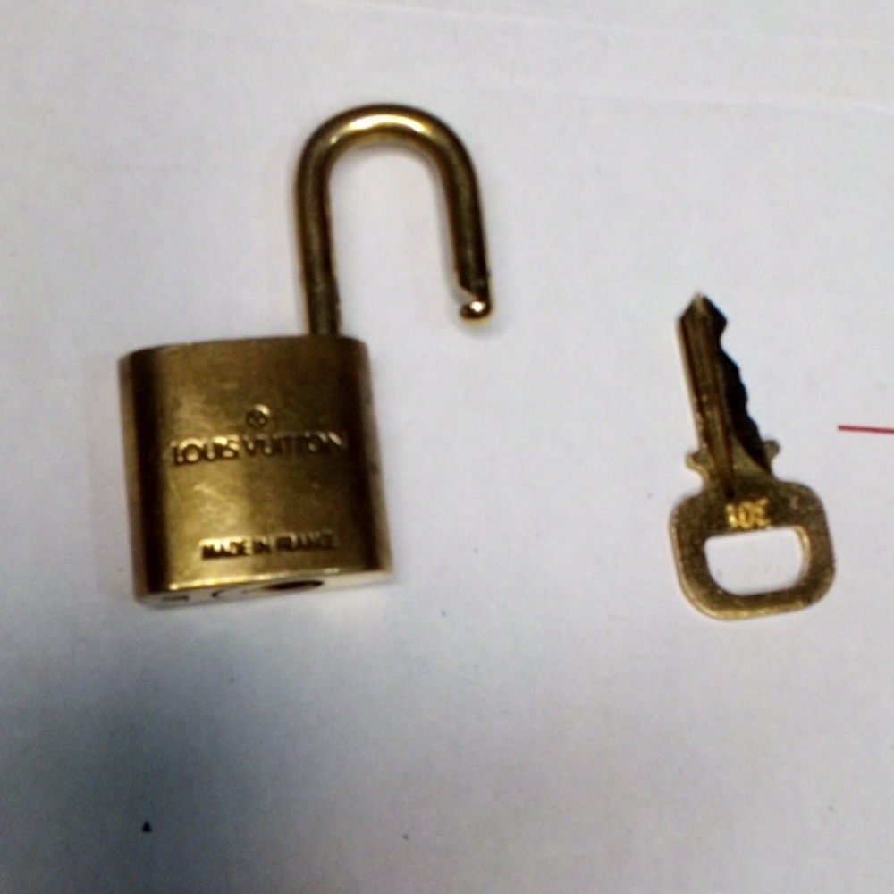 Authentic Louis Vuitton Lock & Key Set #301. Good condition.